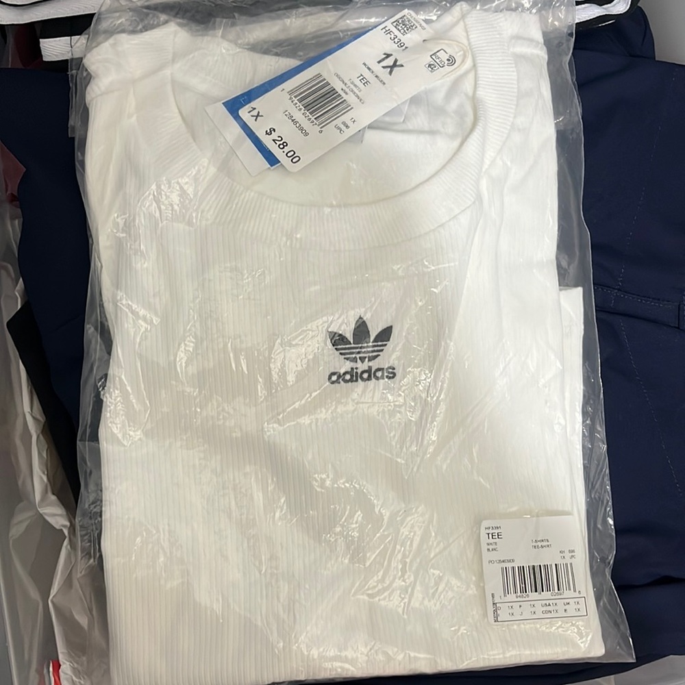 Brand new with tags Womens Adidas tee. In original package